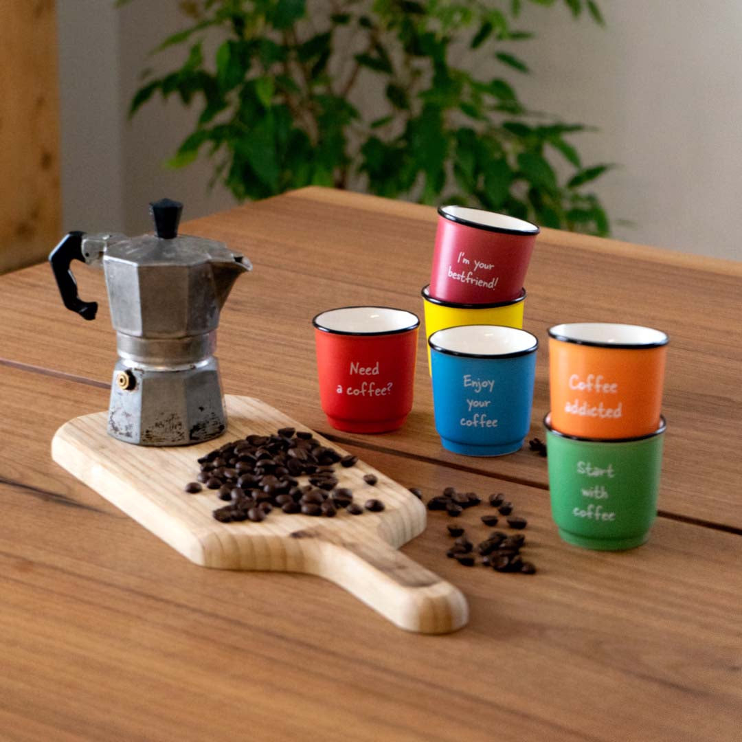 Set of 6 colored cups with writings. Capacity 100 ml.