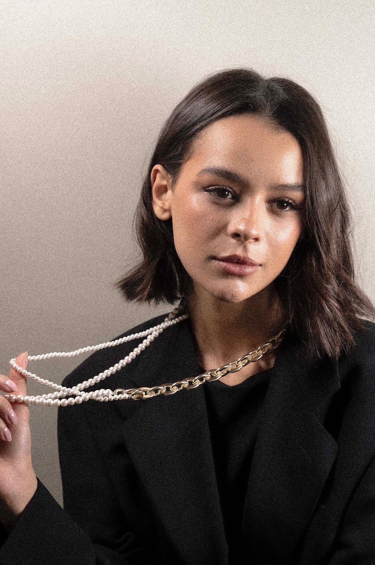 Long necklace with oval link and double strand of pearls
